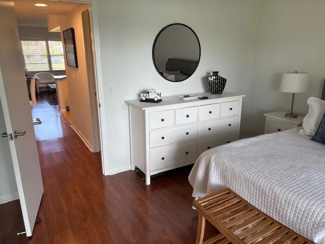 a spacious bathroom with a granite countertop sink and a mirror