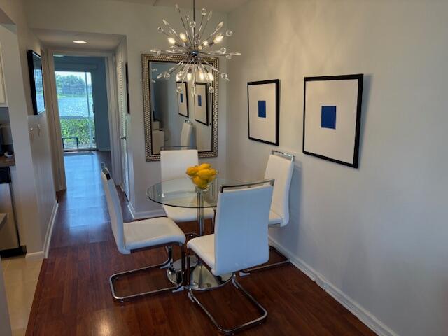 7 Dorset A, Unit 7 Boca Raton, FL 33434 - Photo 5 of 20 a view of a dining room with furniture and wooden floor