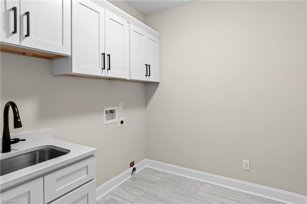159 Wynnfall Drive Lexington, NC 27295 - Photo 10 of 27 Laundry Room with Utility Sink and Cabinets