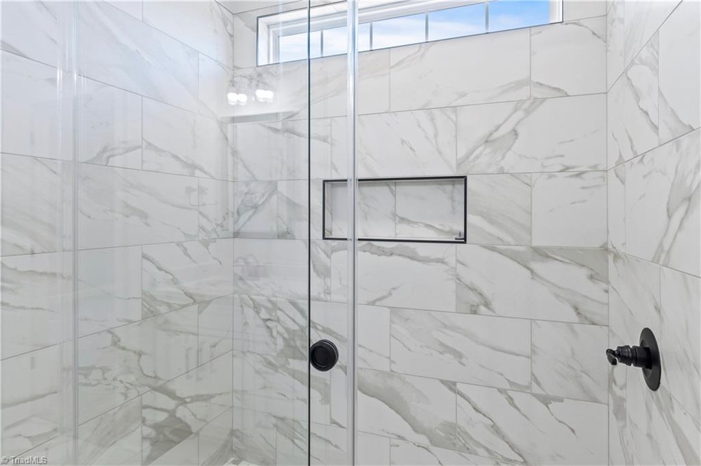 159 Wynnfall Drive Lexington, NC 27295 - Photo 15 of 27 Tiled Primary Walk In Shower with Large Delta Showerheads