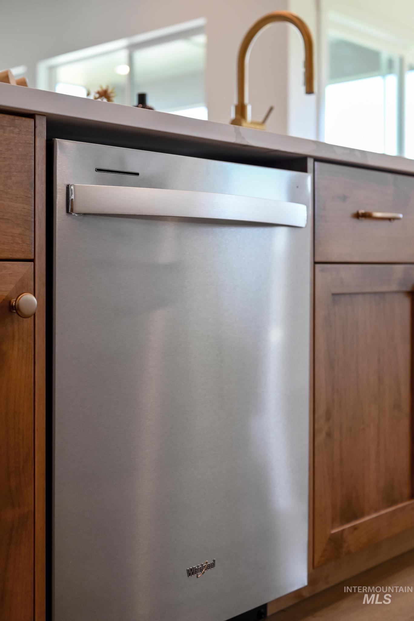 5407 Sparky Avenue Caldwell, ID 83607 - Photo 13 of 41 Kitchen view of dishwasher and brown cabinets