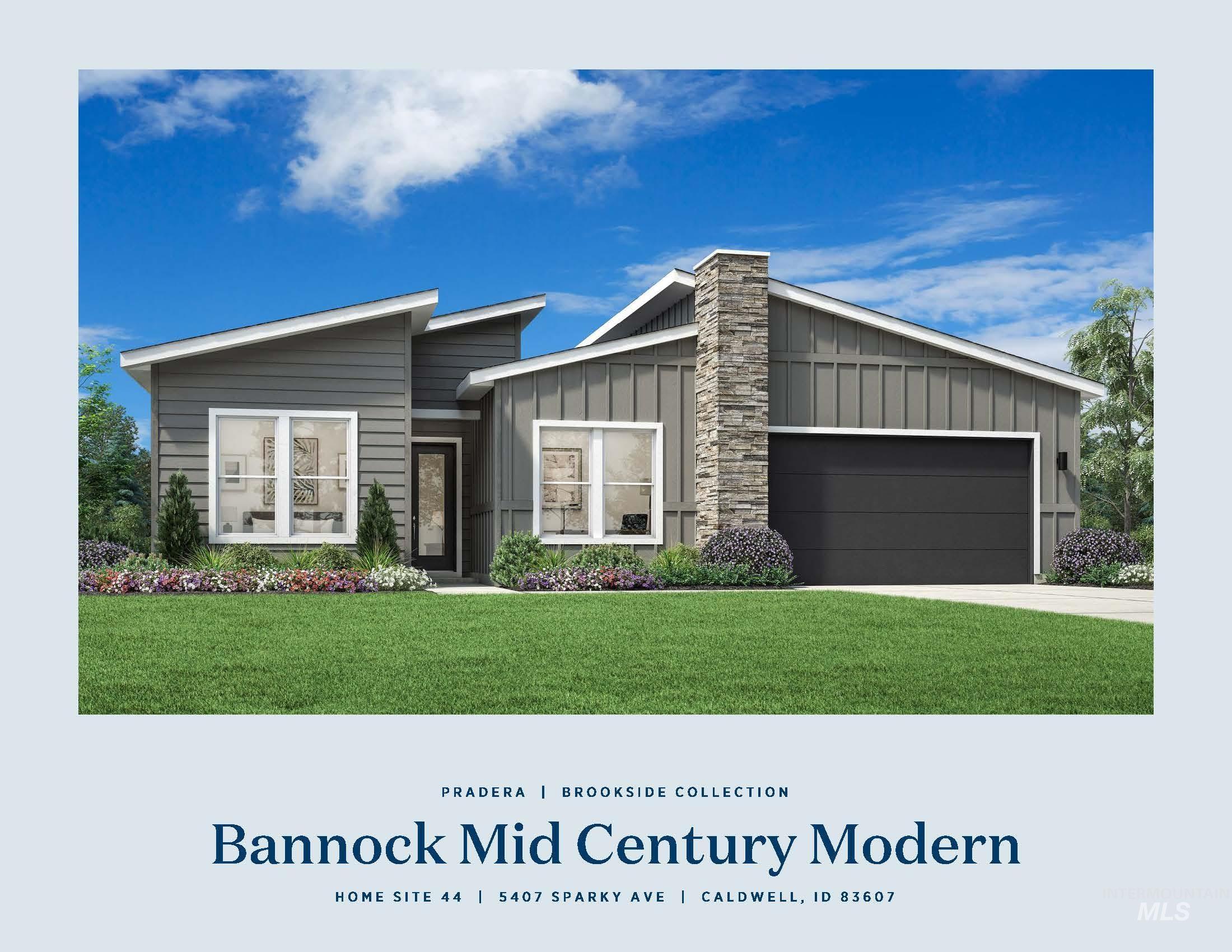 5407 Sparky Avenue Caldwell, ID 83607 - Photo 33 of 41 View of front of property with board and batten siding, a front lawn, a garage, and driveway
