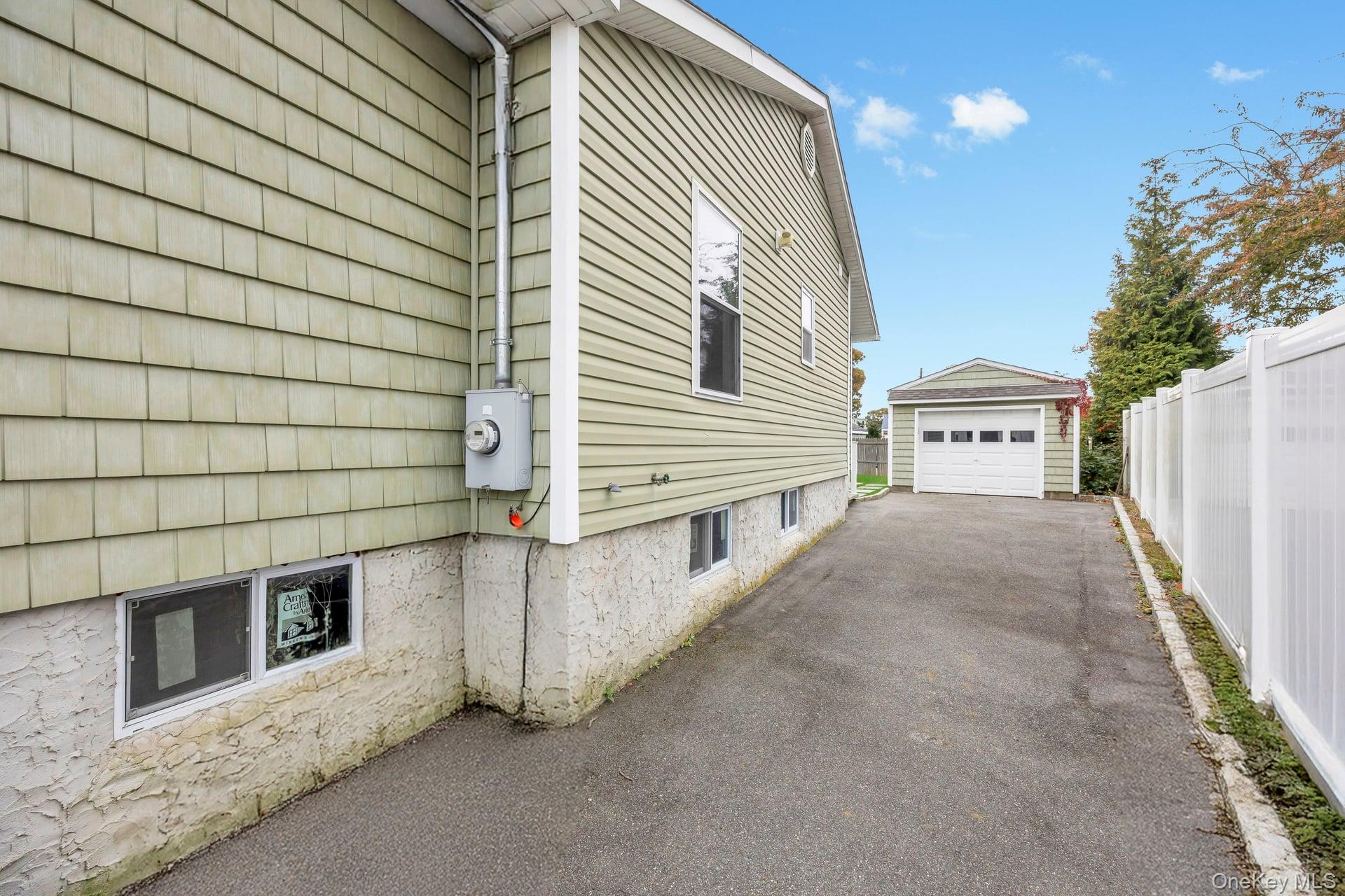 21 Ireland Place Copiague, NY 11726 - Photo 5 of 26 a view of a car garage