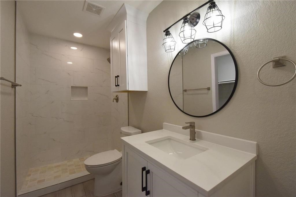 8600 Fathom Circle, Unit 1408 Austin, TX 78750 - Photo 12 of 17 a bathroom with a sink and a mirror