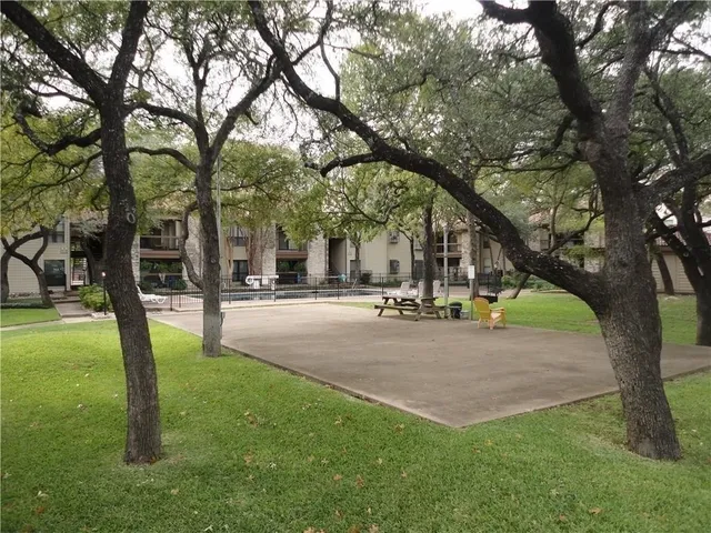 a view of a tree in front of a house