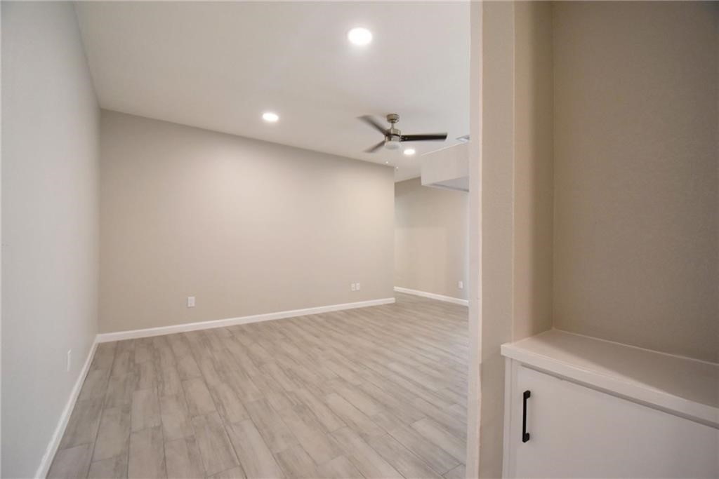 8600 Fathom Circle, Unit 1408 Austin, TX 78750 - Photo 6 of 17 a view of an empty room with wooden floor