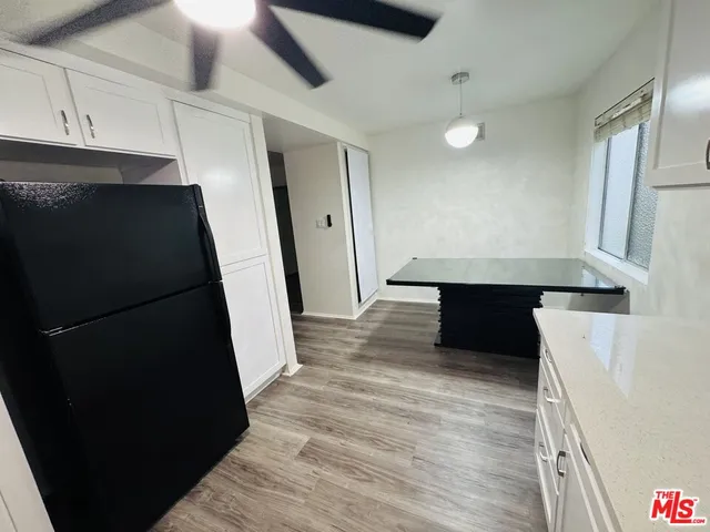 a view of a refrigerator a sink and dishwasher in a kitchen