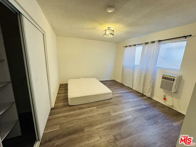 a view of a hardwood floor and staircase