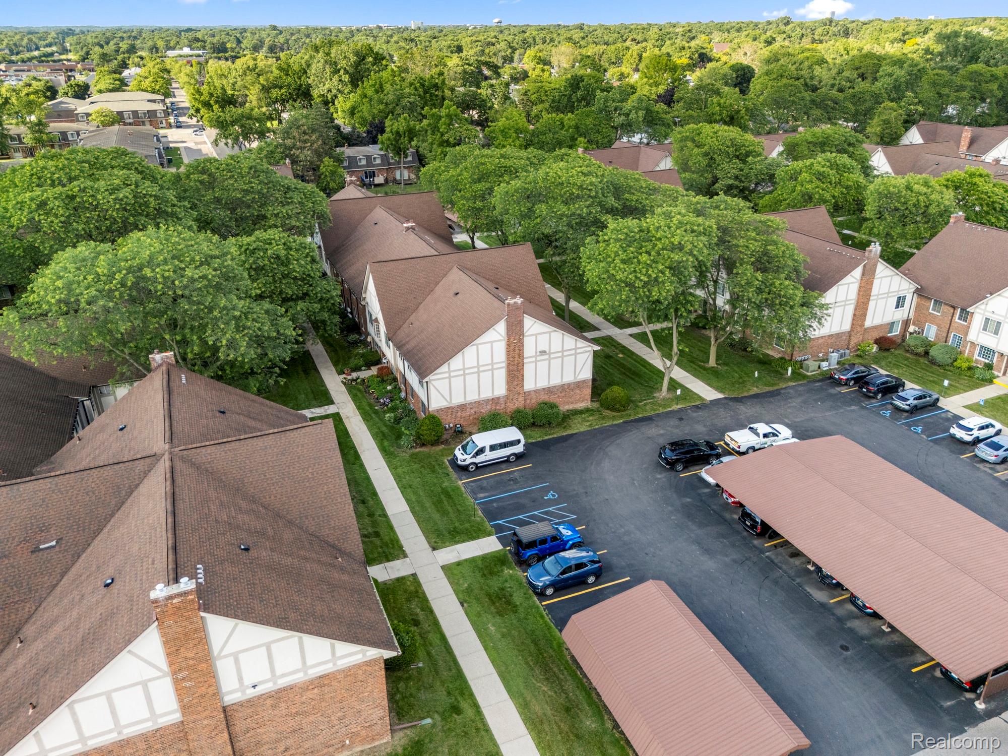 30220 Southfield Road Southfield, MI 48076 - Photo 10 of 13 Aerial perspective showcasing multiple residential buildings with brown shingle roofs and brick facades