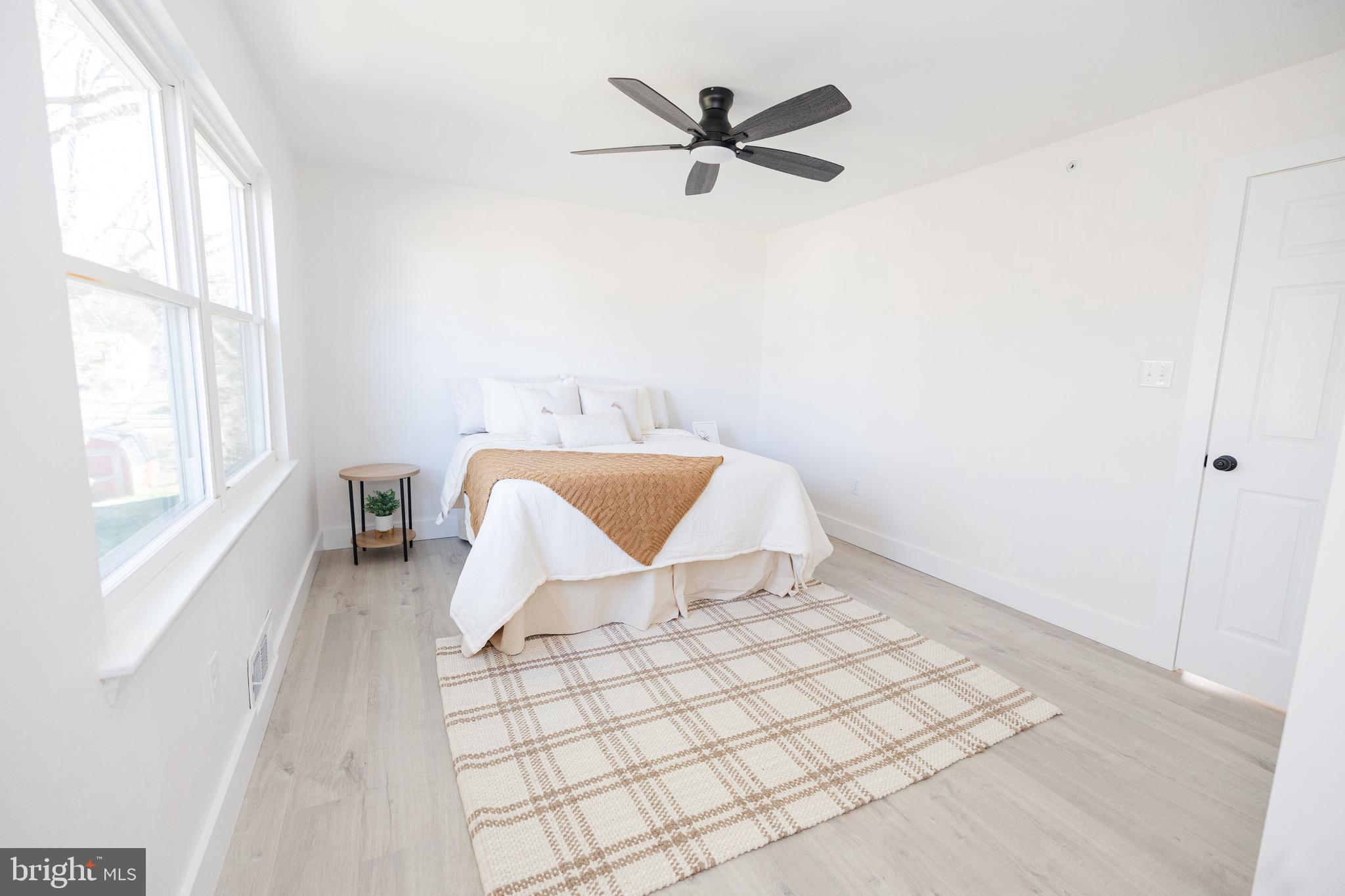6 Valley Bend Road Westminster, MD 21157 - Photo 21 of 41 a view of a bedroom with wooden floor and window