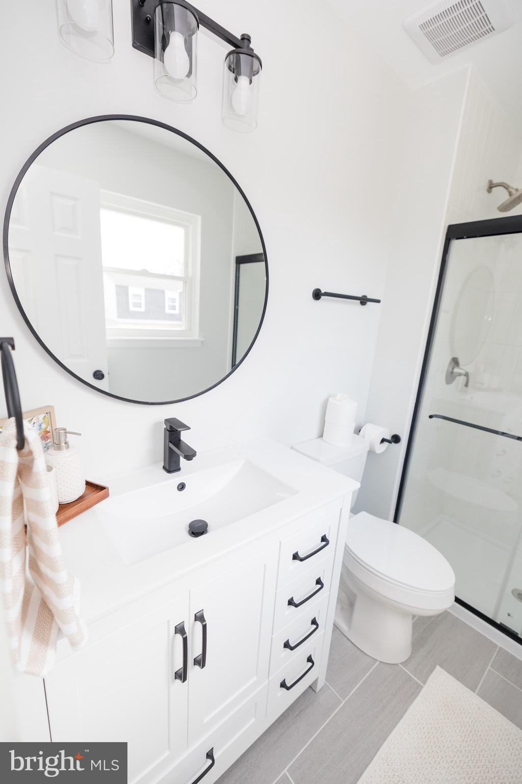6 Valley Bend Road Westminster, MD 21157 - Photo 23 of 41 a bathroom with a sink a mirror and toilet