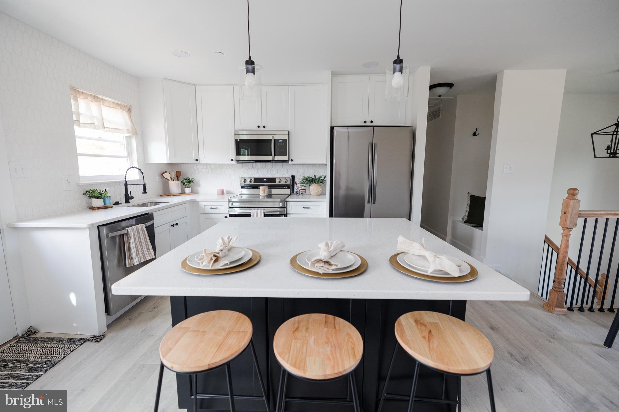 6 Valley Bend Road Westminster, MD 21157 - Photo 6 of 41 a view of a dining room with furniture and wooden floor