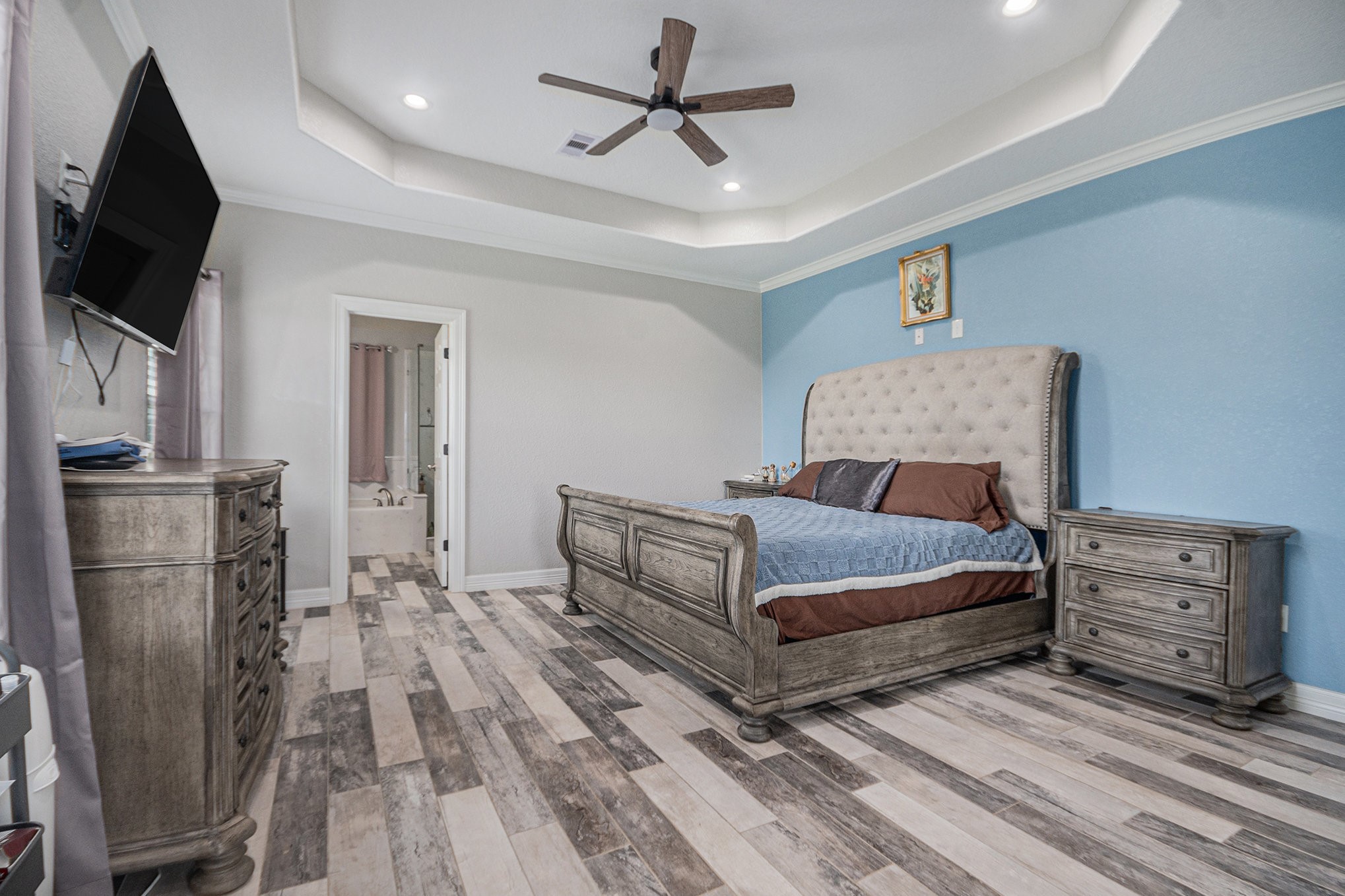 489 Sunset Trail Angleton, TX 77515 - Photo 11 of 39 a bedroom with a bed a flat screen tv and dresser