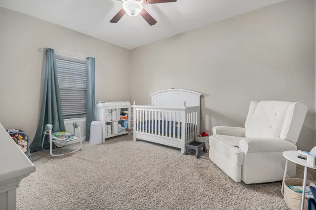 a view of a livingroom with furniture and windows