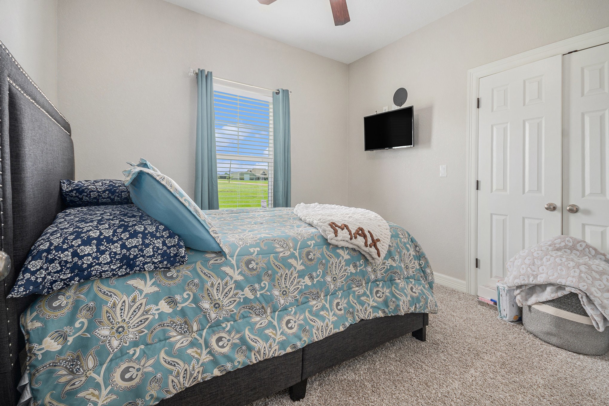 489 Sunset Trail Angleton, TX 77515 - Photo 16 of 39 a bedroom with a bed and flat screen tv