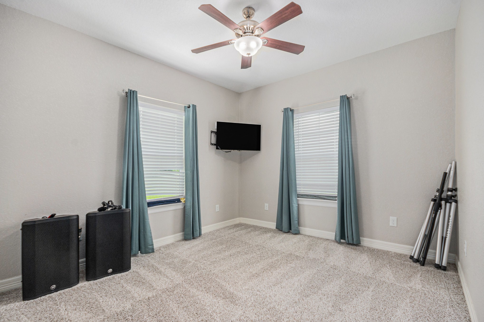 489 Sunset Trail Angleton, TX 77515 - Photo 17 of 39 a bedroom with a bed and a ceiling fan
