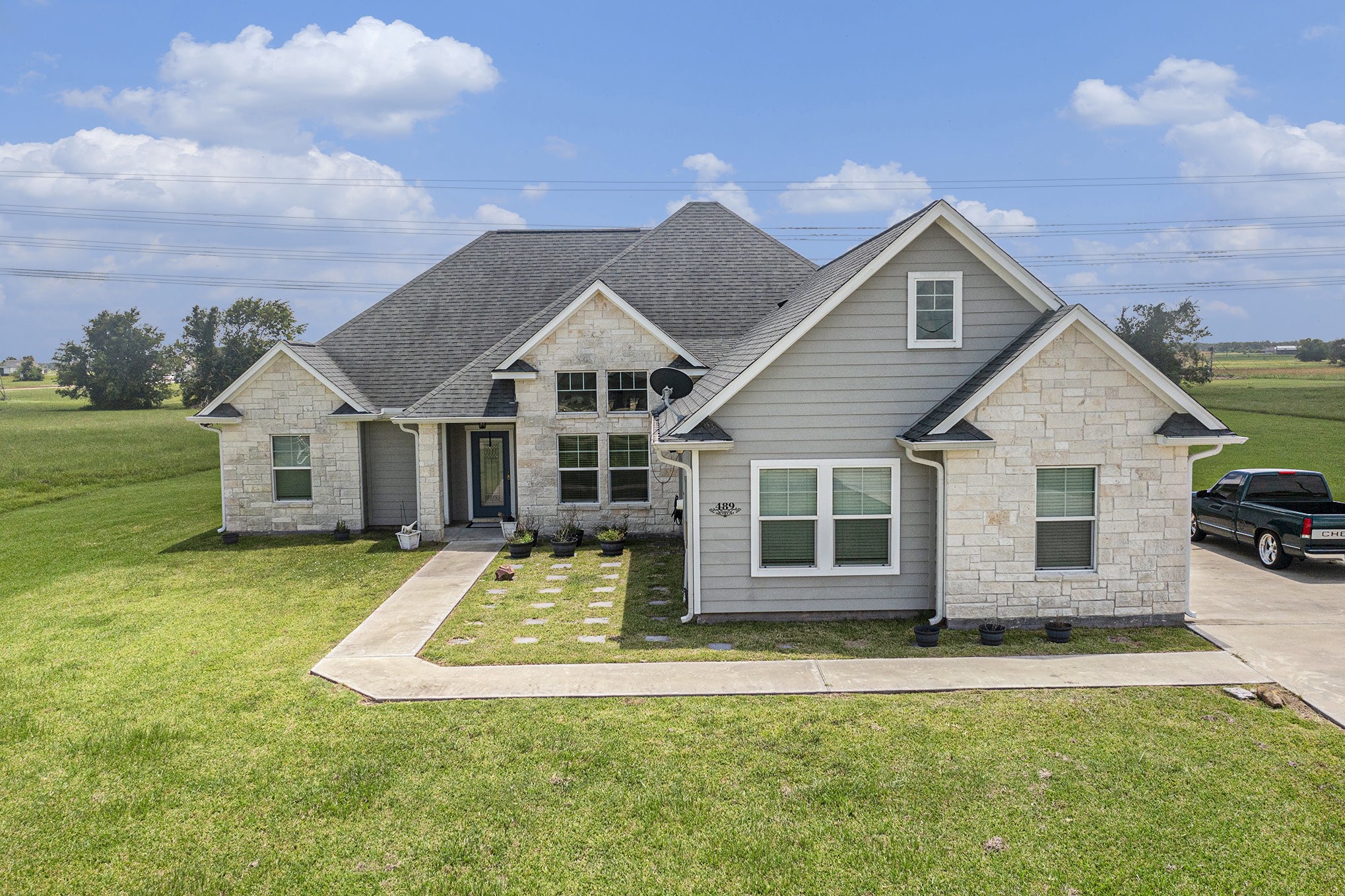 489 Sunset Trail Angleton, TX 77515 - Photo 26 of 39 a front view of a house with a yard