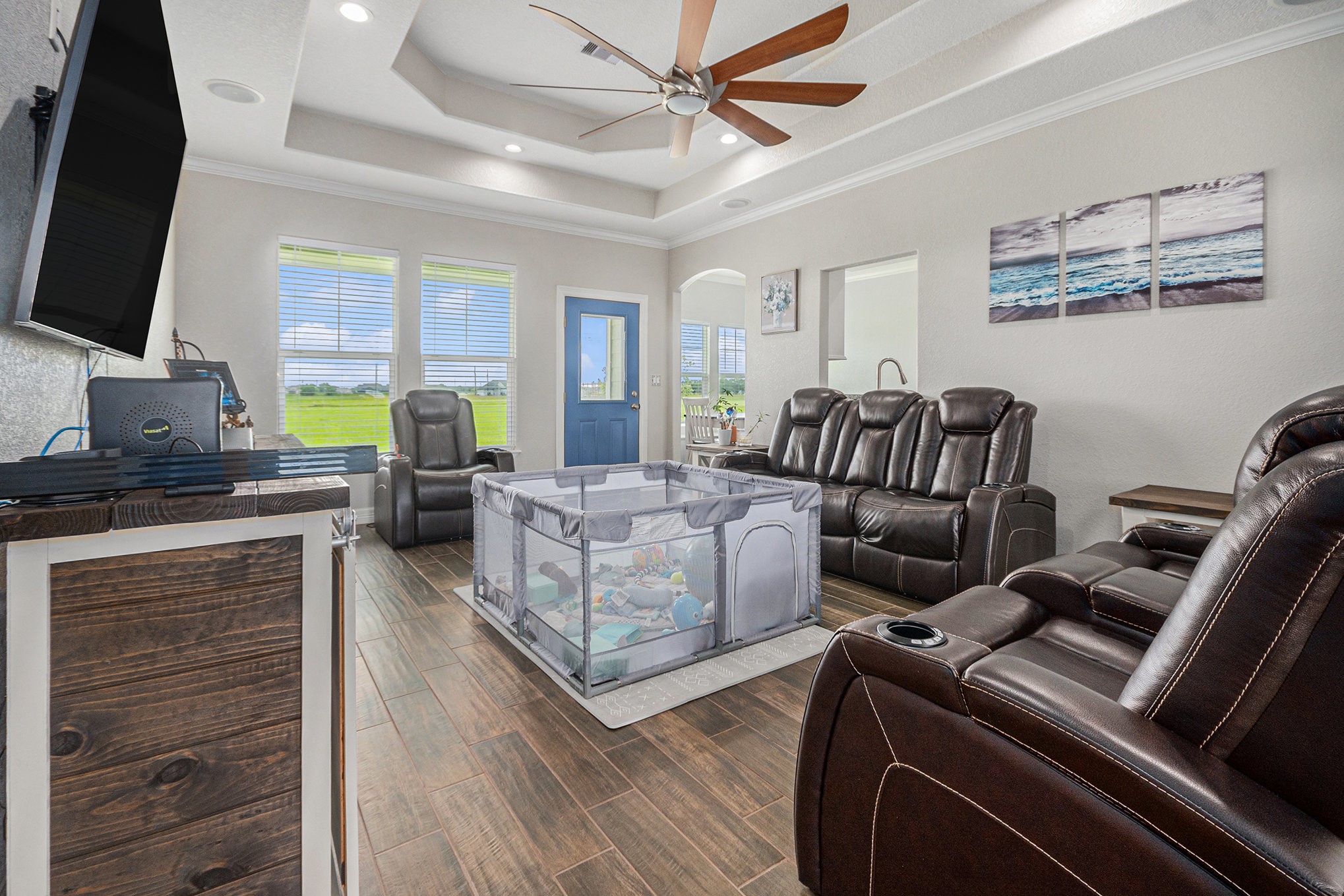 489 Sunset Trail Angleton, TX 77515 - Photo 4 of 39 a living room with furniture a flat screen tv and a fireplace