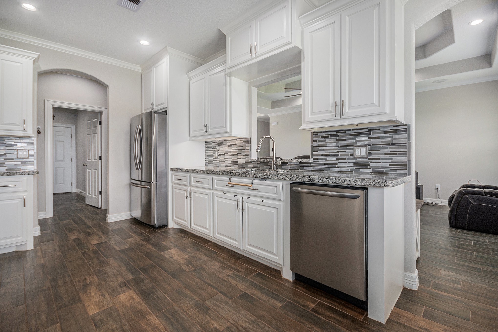 489 Sunset Trail Angleton, TX 77515 - Photo 7 of 39 a kitchen with stainless steel appliances granite countertop a stove and a refrigerator