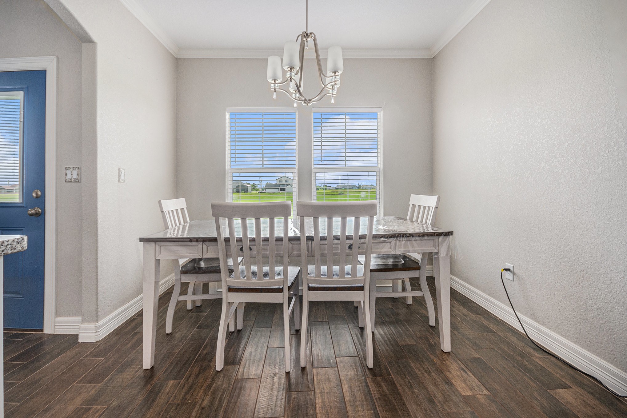 489 Sunset Trail Angleton, TX 77515 - Photo 9 of 39 a view of a dining room with furniture window and wooden floor