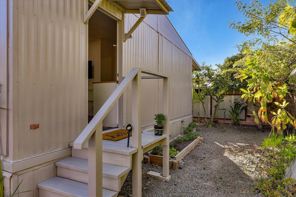 151 Falls View Lane Oceanside, CA 92056 - Photo 25 of 34 Back steps to auxiliary dwelling unit or 2nd bedroom. See list of fruit trees in listing.