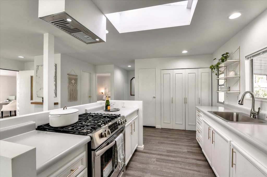 151 Falls View Lane Oceanside, CA 92056 - Photo 6 of 34 Brand new gas stove, 1 year old cabinet depth frig. Recessed lighting on dimmer switch.