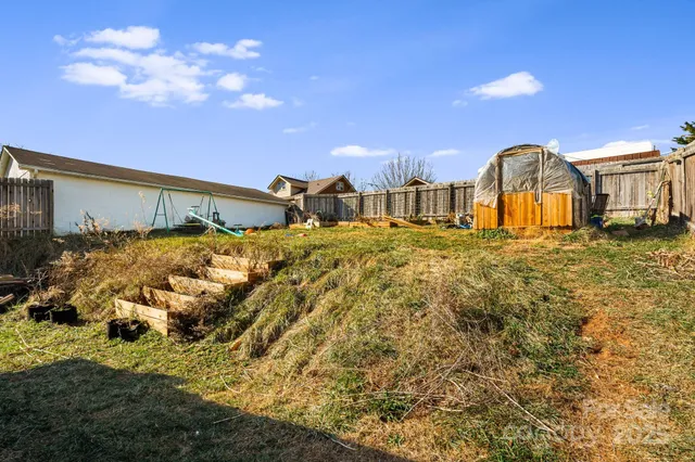 a view of a backyard of the house