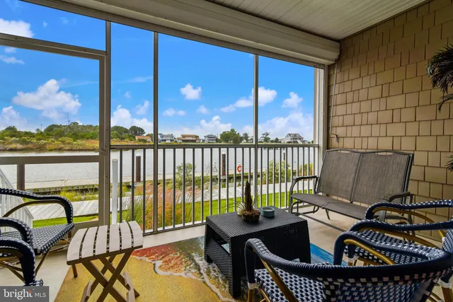 a view of a balcony with chairs
