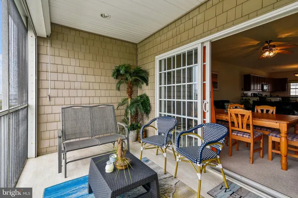 a spacious bedroom with a bed and a chandelier