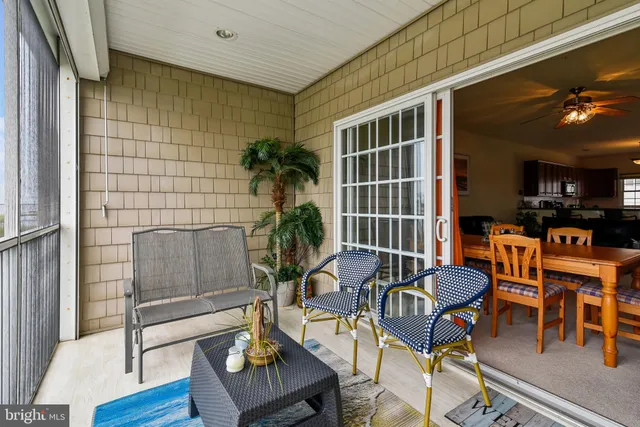 a spacious bedroom with a bed and a chandelier