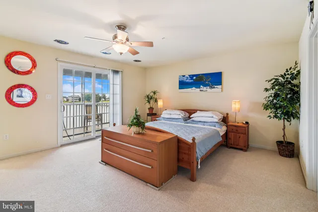 a bed room with a bed and a large window