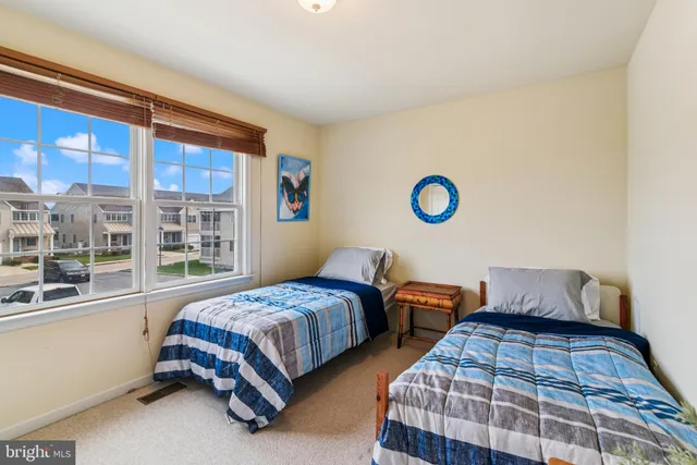 a spacious bathroom with a granite countertop tub sink shower and mirror