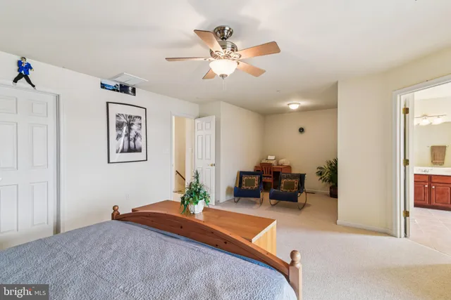 a living room with furniture gym equipment and a fireplace
