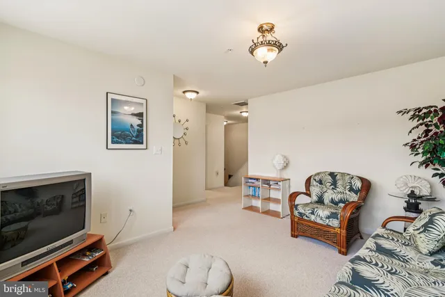 a view of a house with wooden deck