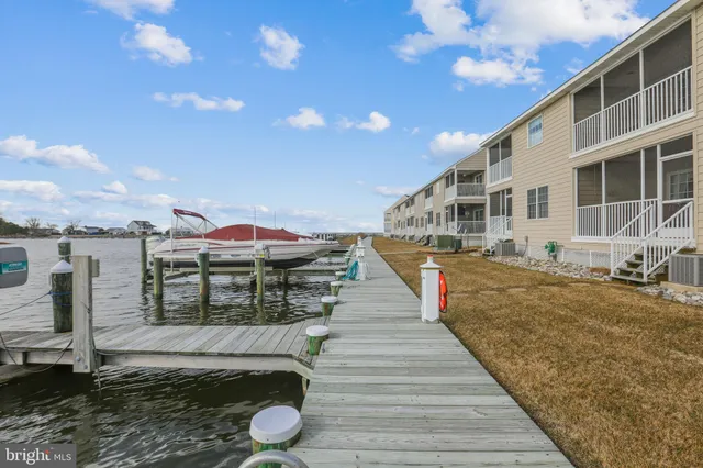 a view of a lake with sitting area