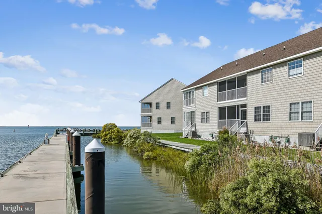 a view of a house with wooden deck