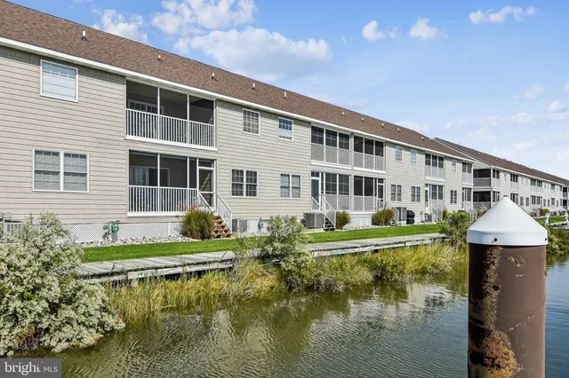 a view of a lake with a city from a terrace