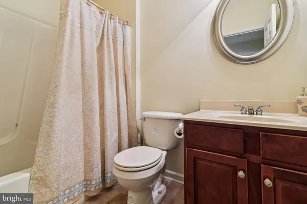 a room with furniture and a potted plant