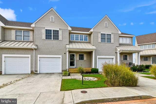 a kitchen with stainless steel appliances granite countertop wooden cabinets a stove top oven a sink and dishwasher