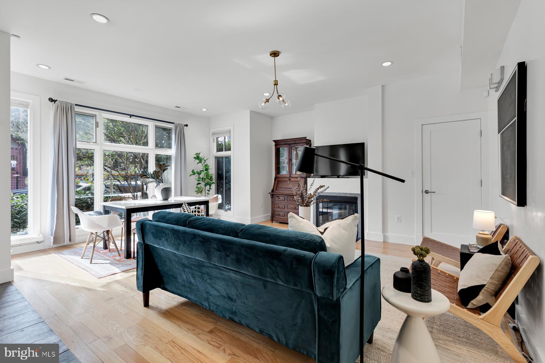 801 Q Street Northwest, Unit 1 Washington, DC 20001 - Photo 11 of 39 a living room with furniture and a window