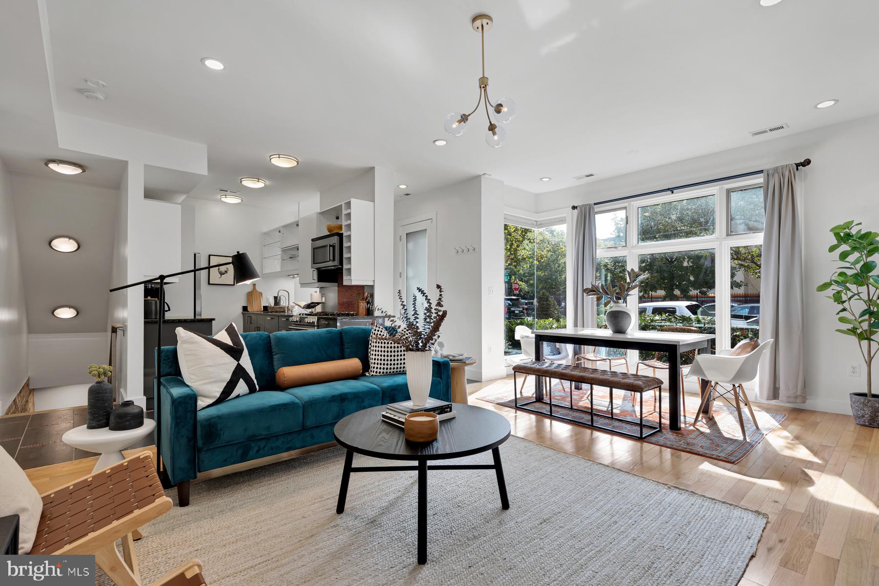 801 Q Street Northwest, Unit 1 Washington, DC 20001 - Photo 12 of 39 a living room with furniture and a wooden floor