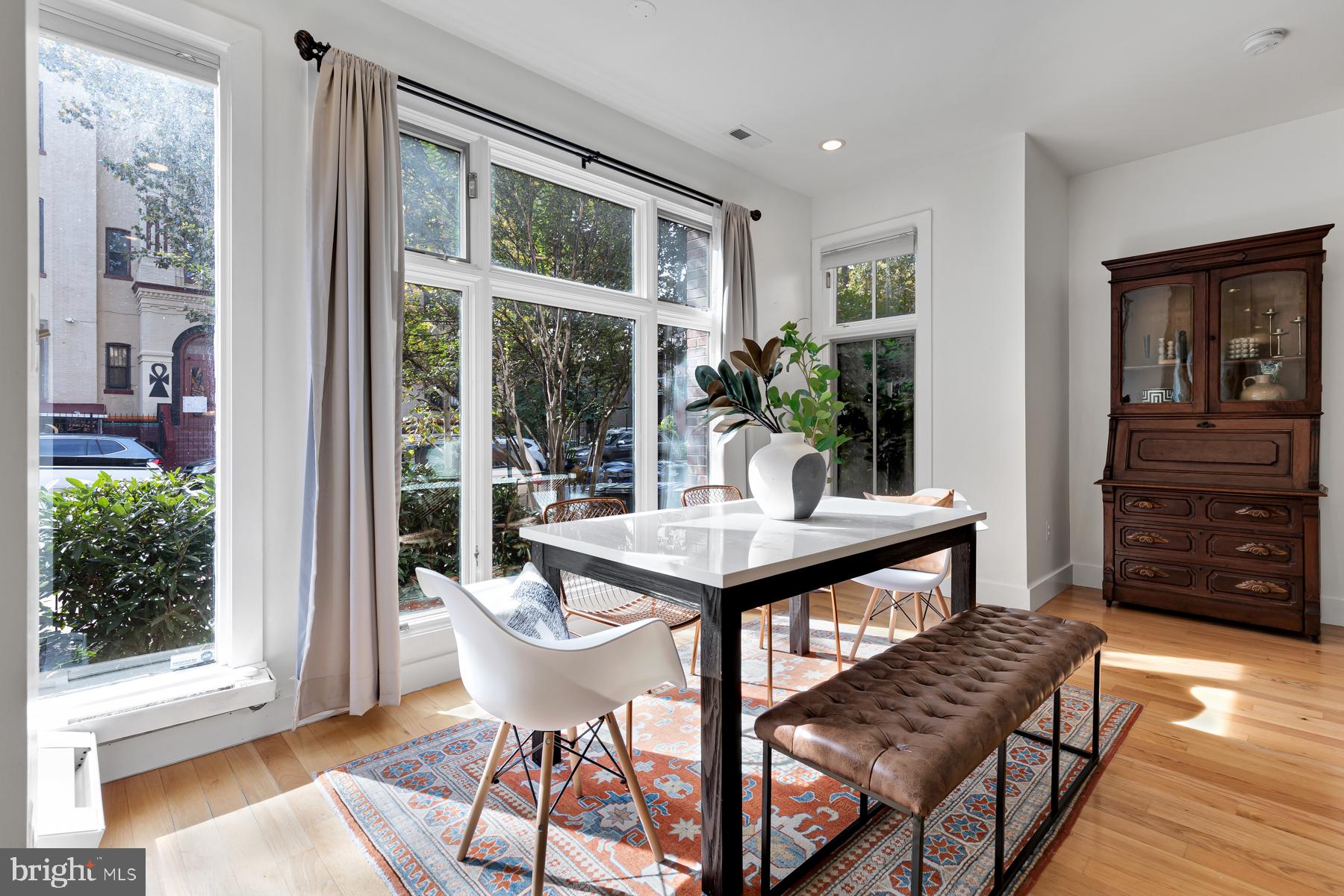 801 Q Street Northwest, Unit 1 Washington, DC 20001 - Photo 14 of 39 a view of a dining room with furniture window and wooden floor
