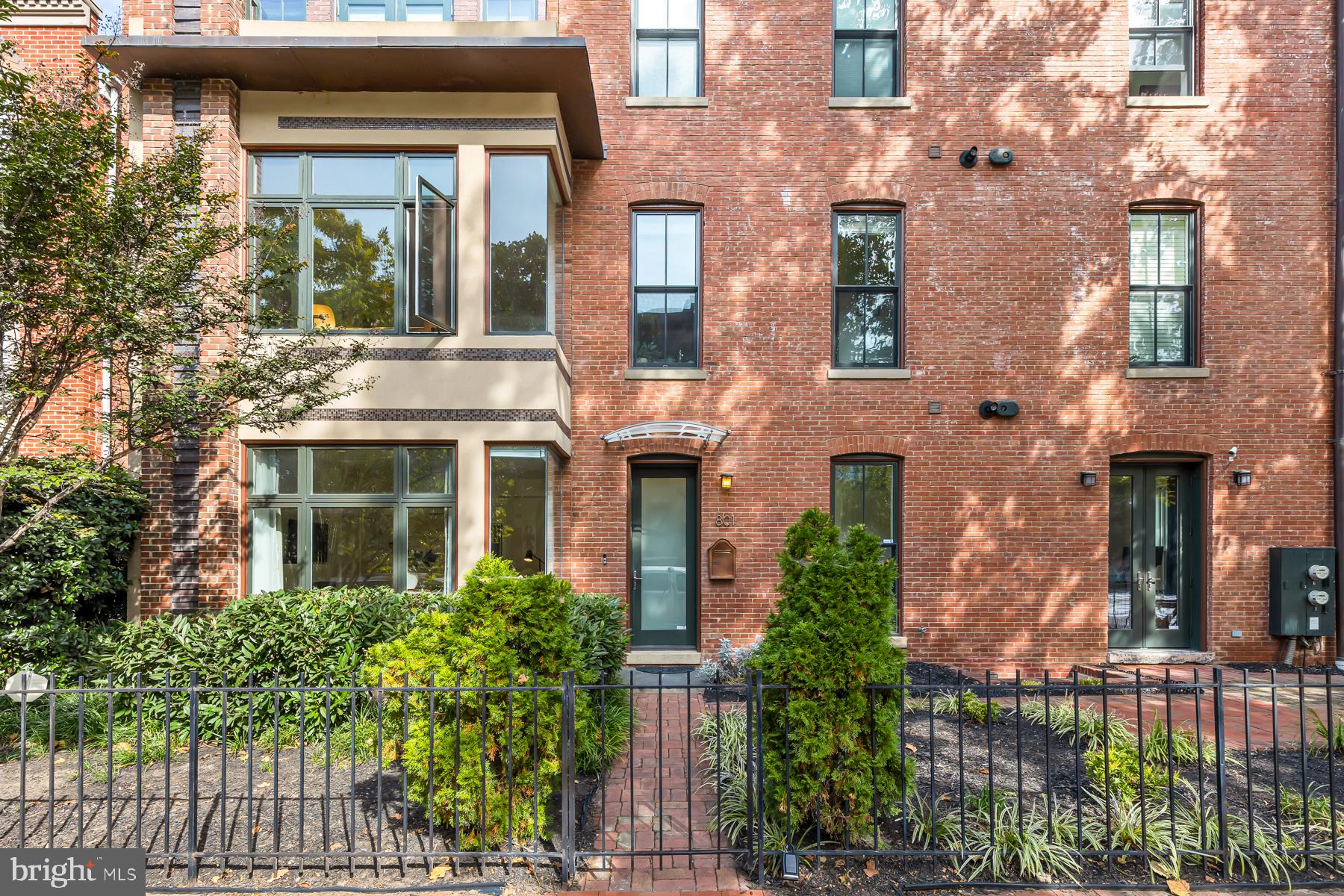 801 Q Street Northwest, Unit 1 Washington, DC 20001 - Photo 2 of 39 front view of a brick house with a large windows