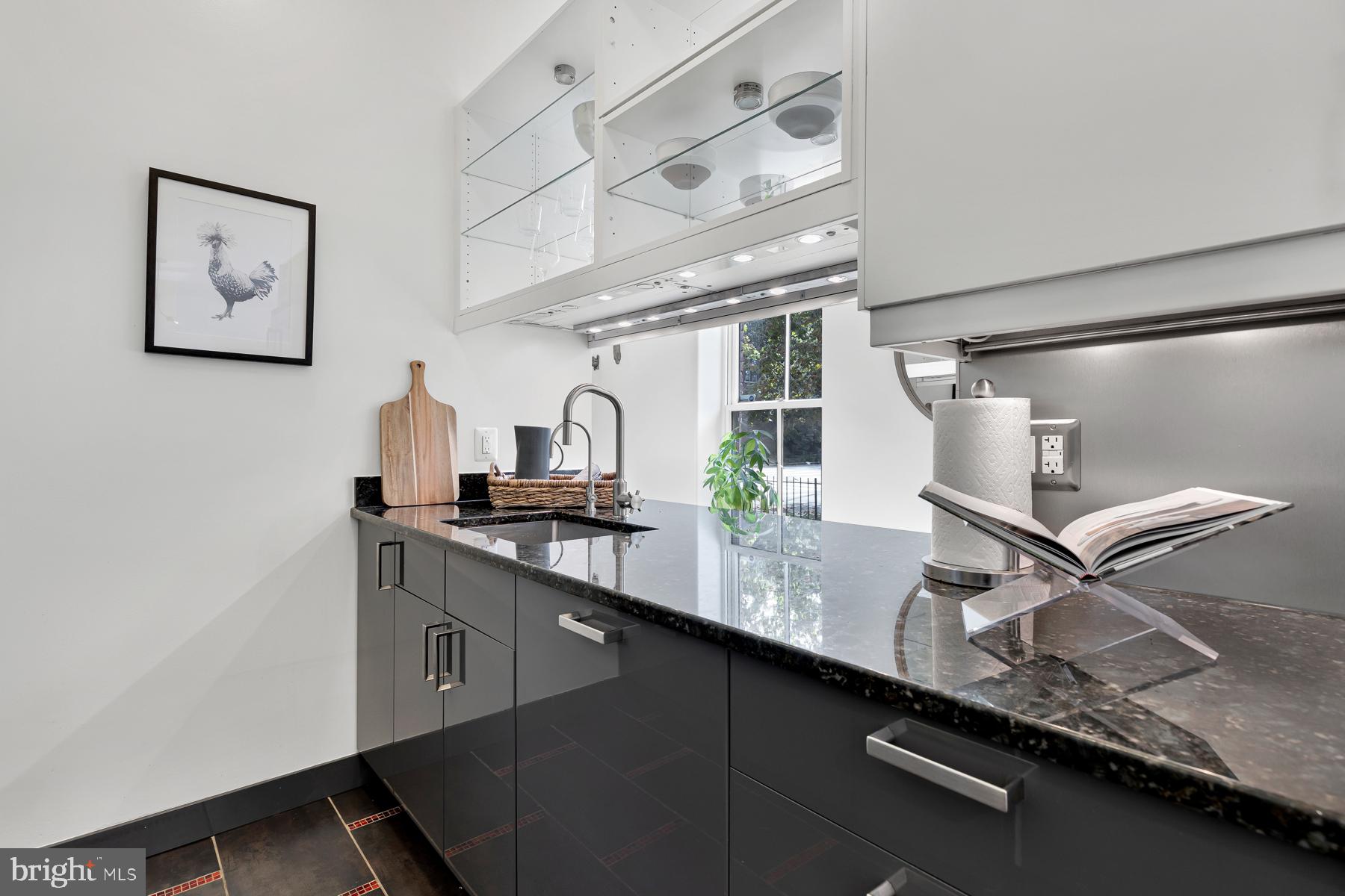 801 Q Street Northwest, Unit 1 Washington, DC 20001 - Photo 21 of 39 a kitchen with a sink and a refrigerator