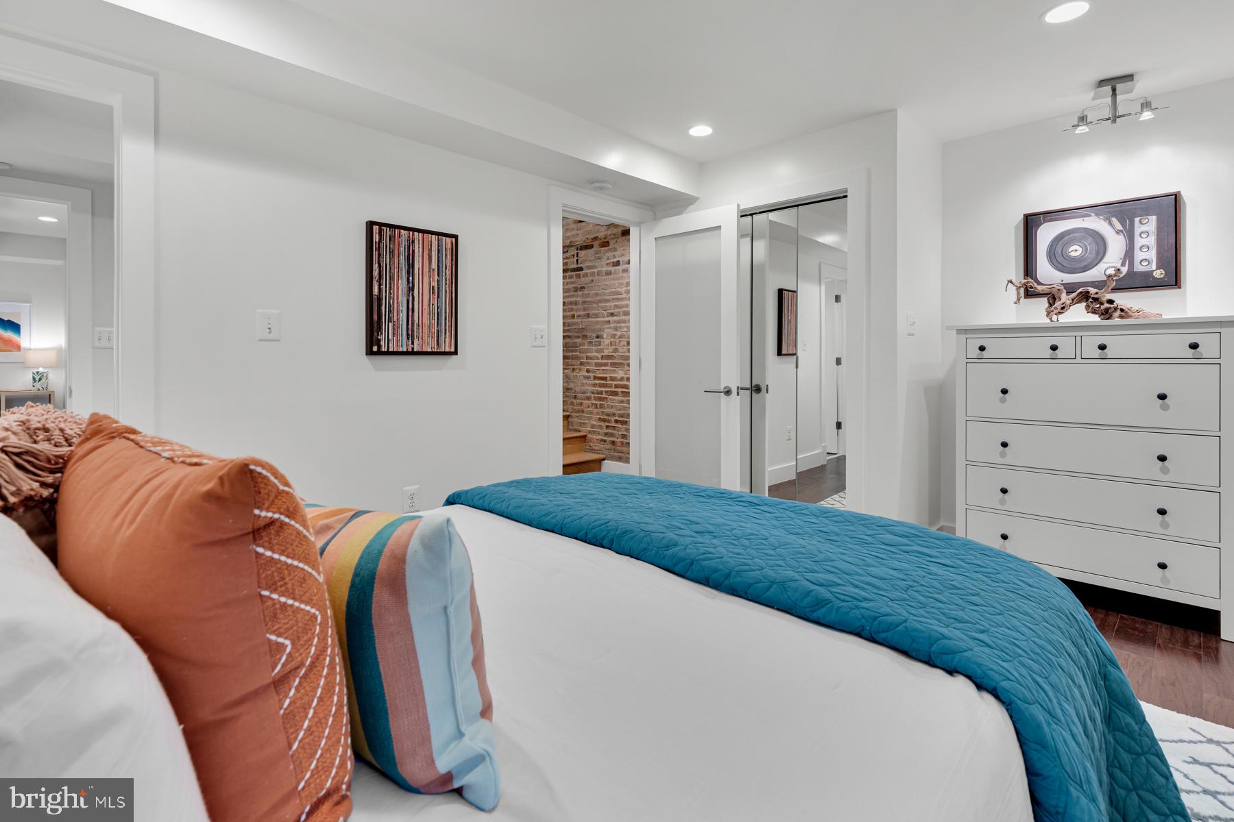 801 Q Street Northwest, Unit 1 Washington, DC 20001 - Photo 25 of 39 a bedroom with a bed and a lamp