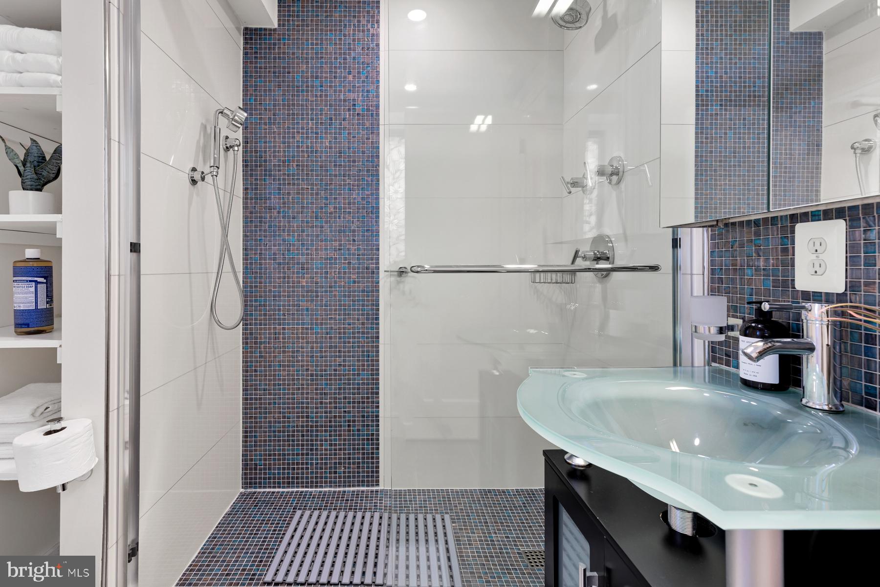 801 Q Street Northwest, Unit 1 Washington, DC 20001 - Photo 27 of 39 a kitchen with a sink a refrigerator and cabinets