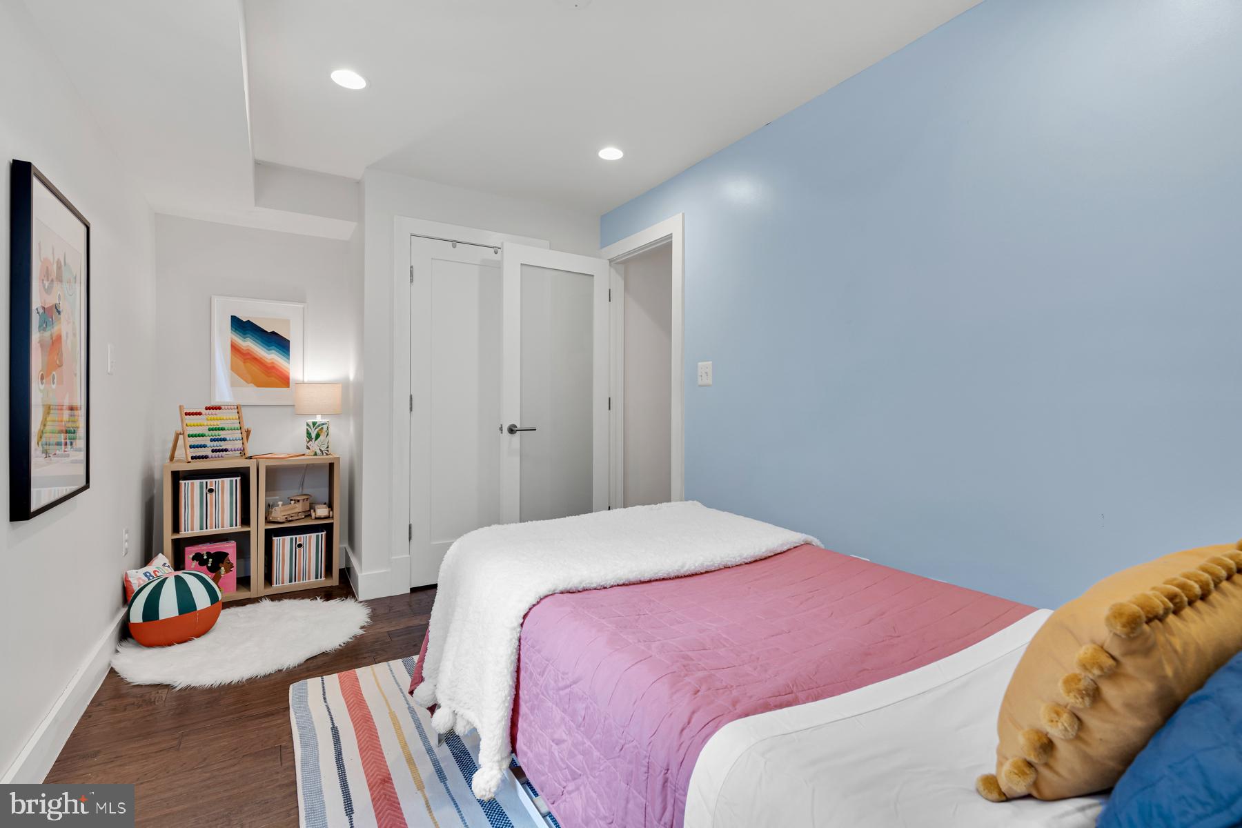 801 Q Street Northwest, Unit 1 Washington, DC 20001 - Photo 29 of 39 a bedroom with a bed and a window
