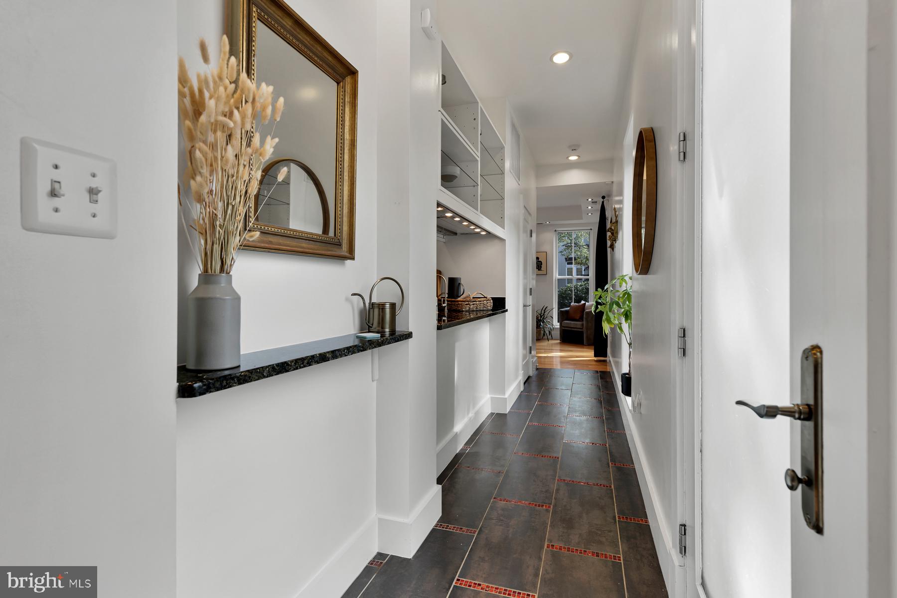 801 Q Street Northwest, Unit 1 Washington, DC 20001 - Photo 3 of 39 a view of a hallway with wooden floor and staircase