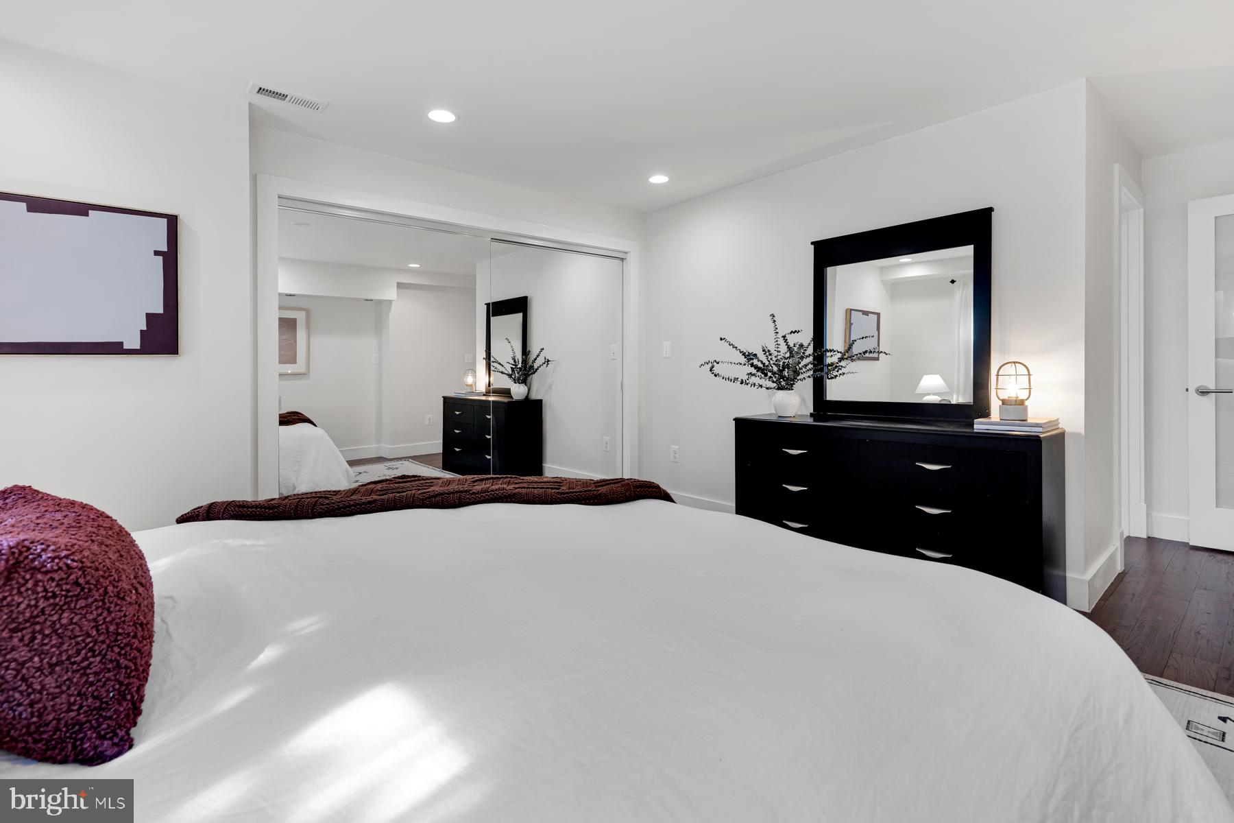 801 Q Street Northwest, Unit 1 Washington, DC 20001 - Photo 33 of 39 a bedroom with a bed and a dresser