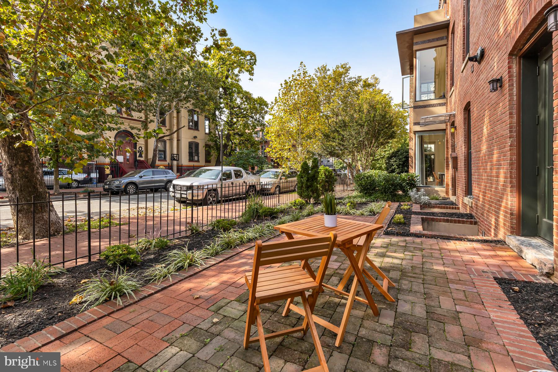 801 Q Street Northwest, Unit 1 Washington, DC 20001 - Photo 37 of 39 a view of a patio with table and chairs and potted plants